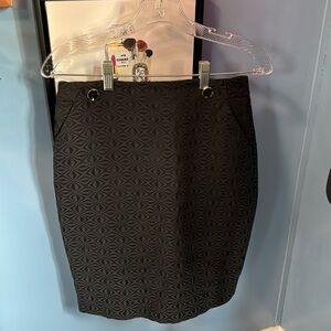 The limited black pencil skirt
